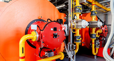 industrial machinery with orange tanks and yellow piping for efficiency in heating systems featuring advanced technology and performance enhancements for optimal results in energy usage 9 systems