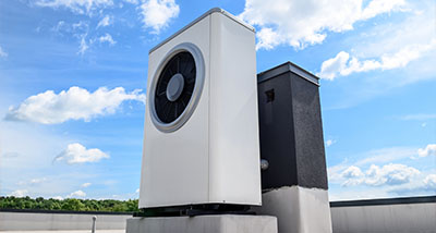 air conditioning units on rooftop under blue sky with fluffy clouds showing energy efficiency options for ten top models